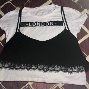 White crop top w/ graphic and black overlay